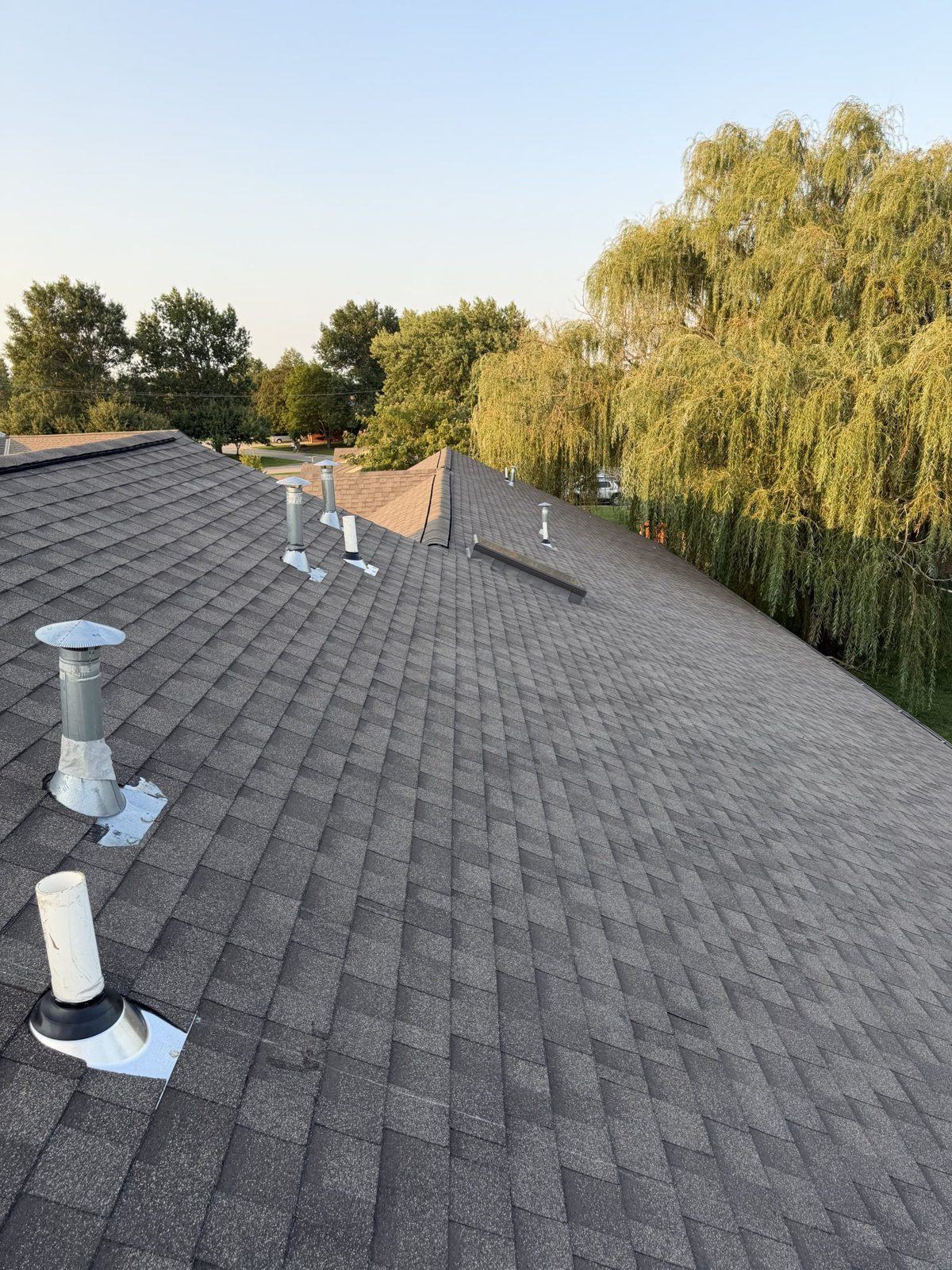 Finished shingle roof on a Kansas City ranch home completed by JJL Construction